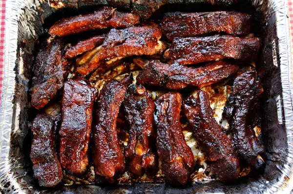 Can you partially cook the ribs and finish later?