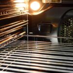 Does oven light affect cooking?