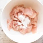 How do you use baking soda to tenderize chicken?