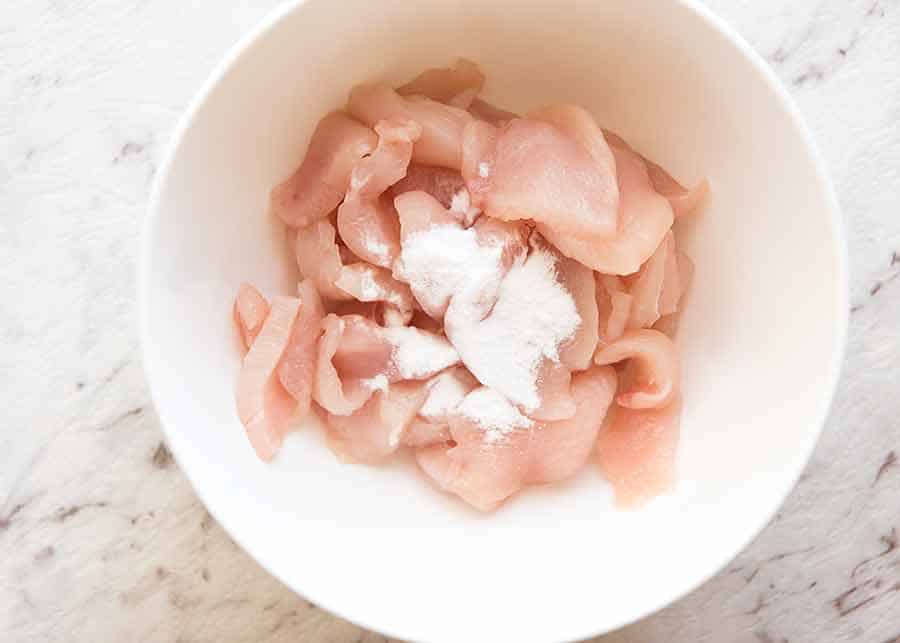 How do you use baking soda to tenderize chicken?