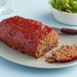 How long does it take to cook a meatloaf at 325?