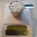 How much does 60 g of dry rice weigh when cooked?
