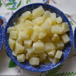 Should potatoes be rinsed after boiling for potato salad?