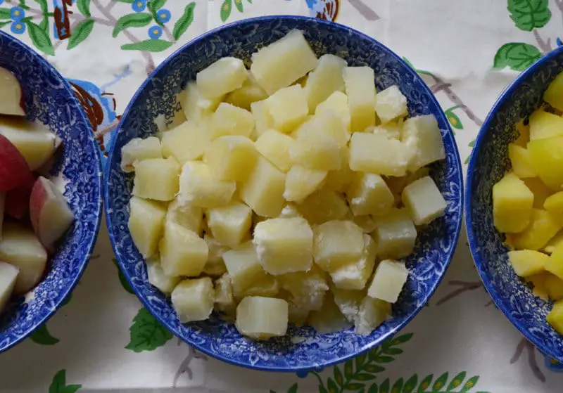 Should potatoes be rinsed after boiling for potato salad?