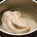What do you do with the liquid after boiling chicken?