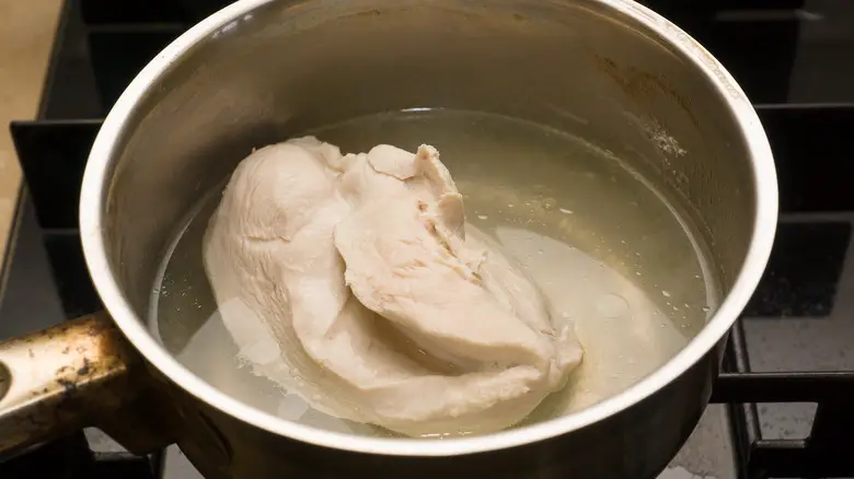 What do you do with the liquid after boiling chicken?