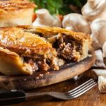 What temperature should a meat pie have when it is cooked?
