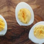 Why are my hard-boiled eggs flat on the bottom?