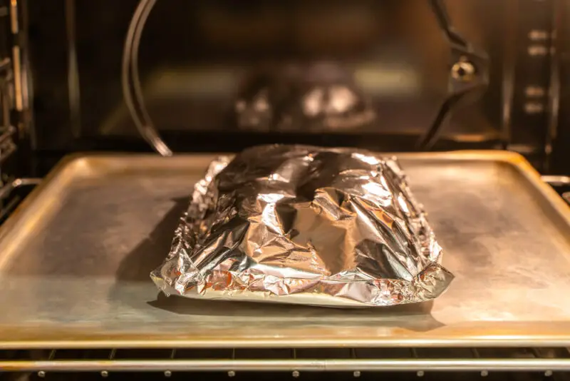 does food cook faster with or without foil
