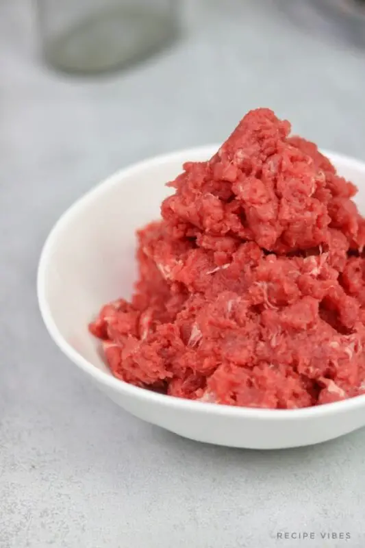 can frozen mince be reheated once cooked